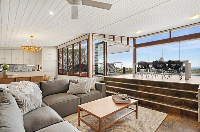 Sunken living room with large L shaped lounge