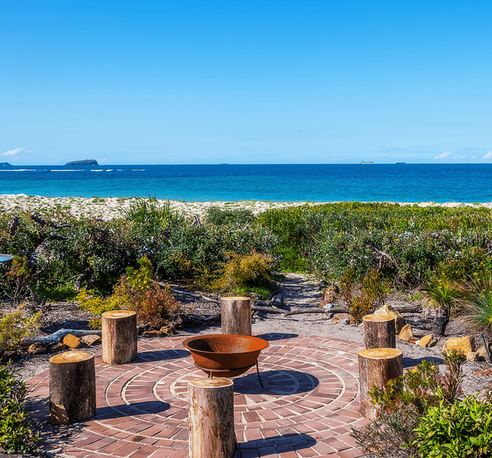 Firepit in dunes with a view of the water